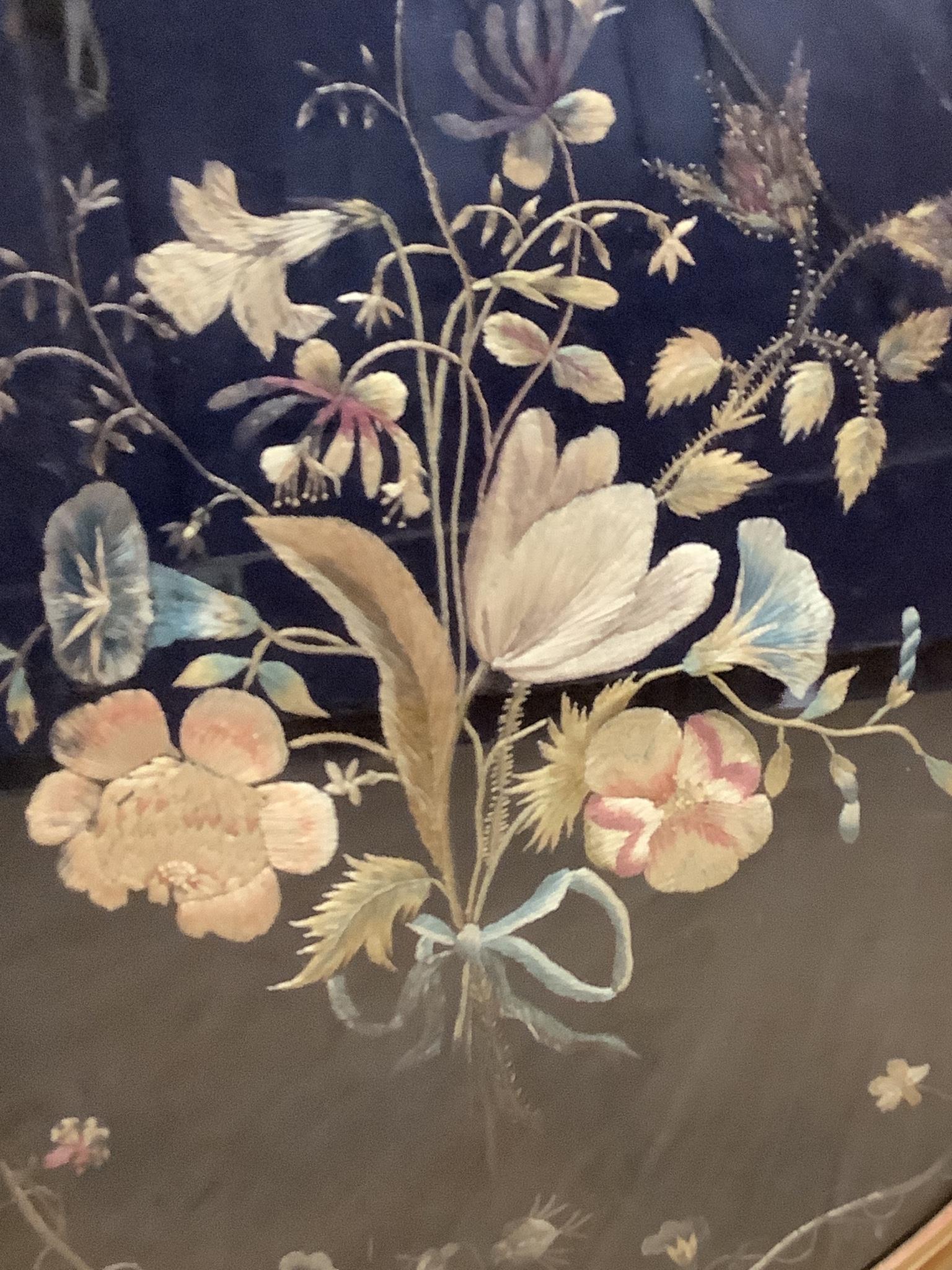 A 19th century silk embroidery of flowers on black silk background, 51 x 45cm